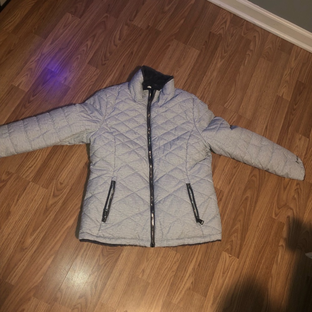 Light grey water proof outside, soft dark grey inside, reversible zip up pockets